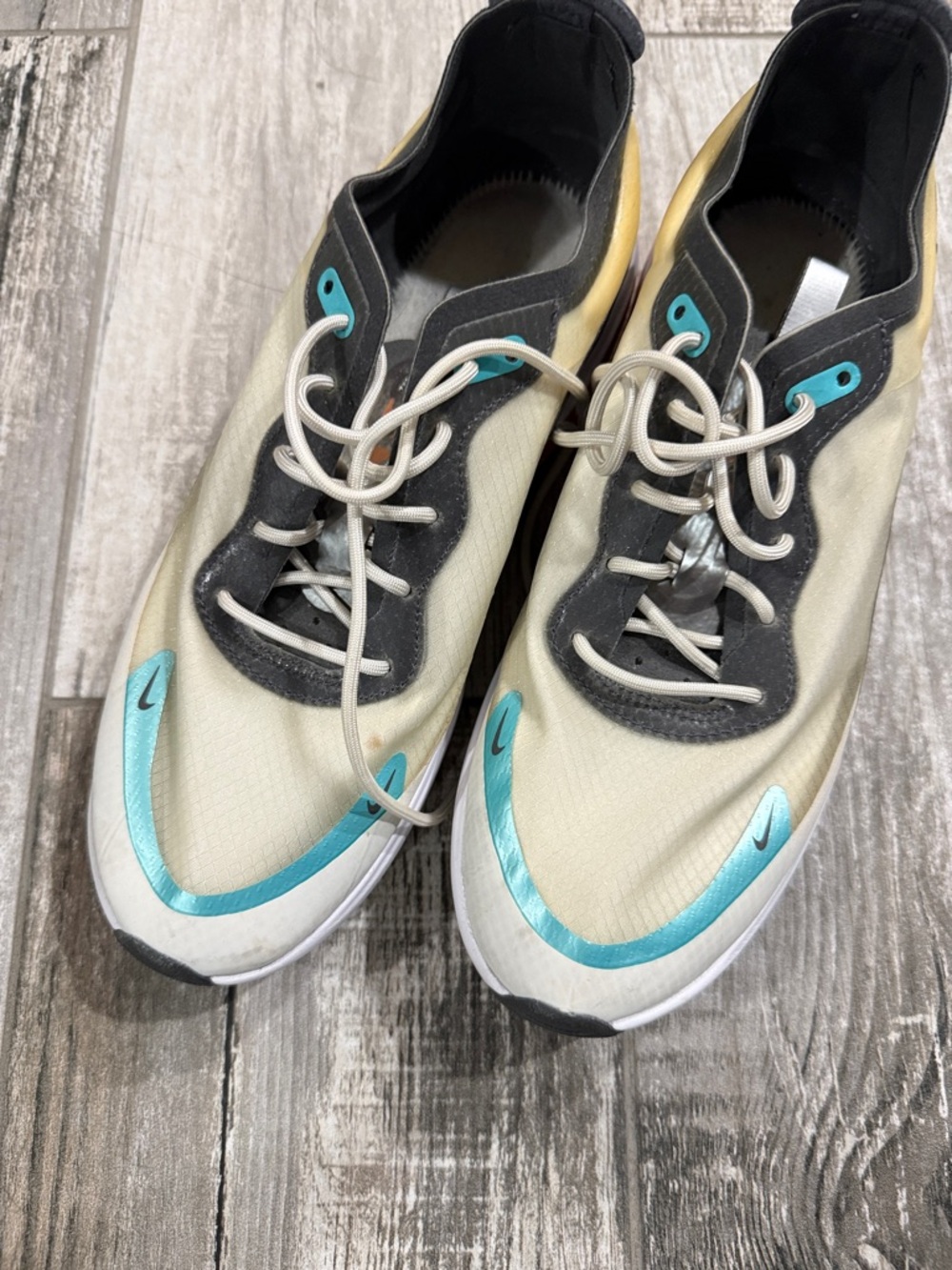 Nike Cream Sneakers with Teal Accents and Black Trim